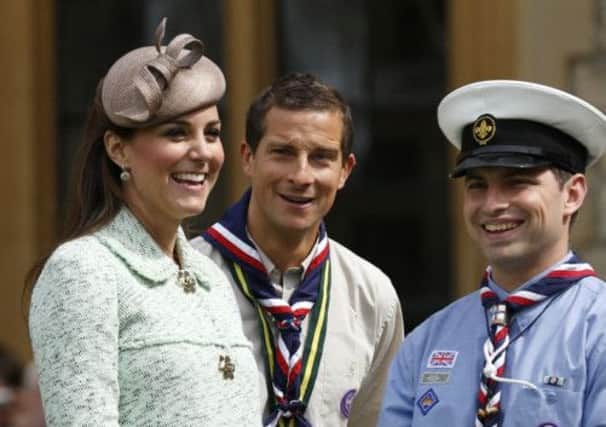 The Duchess of Cambridge, Chief Scout Bear Grylls (C) and Sea Scout Rob Butcher. Picture: Reuters