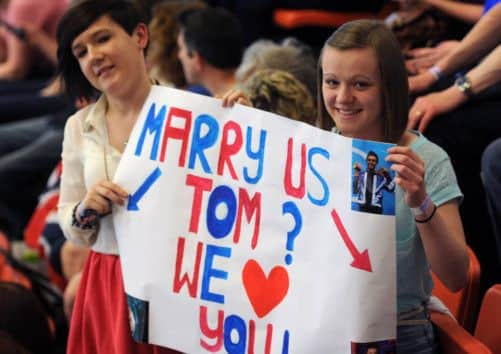 Fans with a home-made banner get their message across. Picture: Ian Rutherford