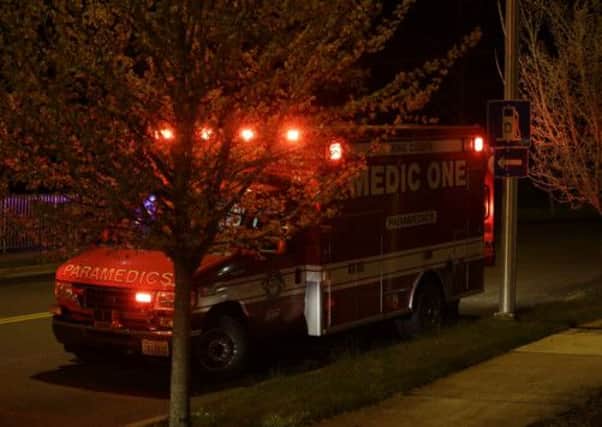 An emergency services vehicle seen near the scene of the shooting, in which five died. Picture: AP