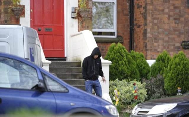 Luis Suarez ventures out in Liverpool yesterday, less than 24 hours after causing outrage by biting Chelsea's Branislav Ivanovic. Picture: PA