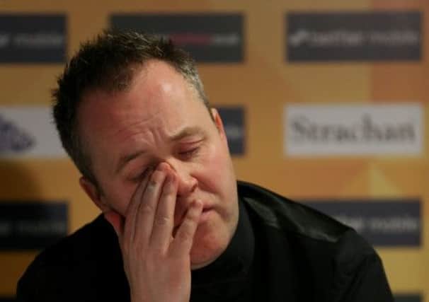 A despondent John Higgins talks to the media after his shock first-round exit in Sheffield. Picture: PA