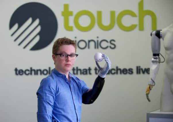 Patrick shows off his bionic hand in Livingston. Picture: Joey Kelly