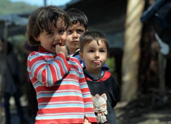 About 1.2 million Syrians have fled to become refugees in neighbouring countries, including these children, who are living in a camp over the Turkish border. Picture: Getty