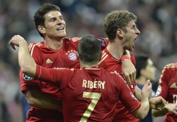 Bayern Munich's Mueller celebrates scoring a goal with Gomez and Ribery. Picture: Getty