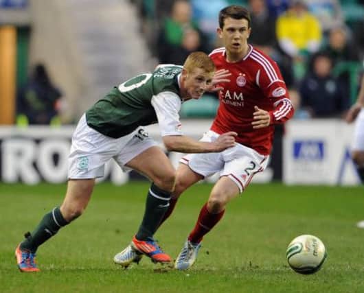 Eoin Doyle tries to find a way past Ryan Jack in Monday night's 0-0 draw against Aberdeen at Easter Road. Picture: Ian Rutherford