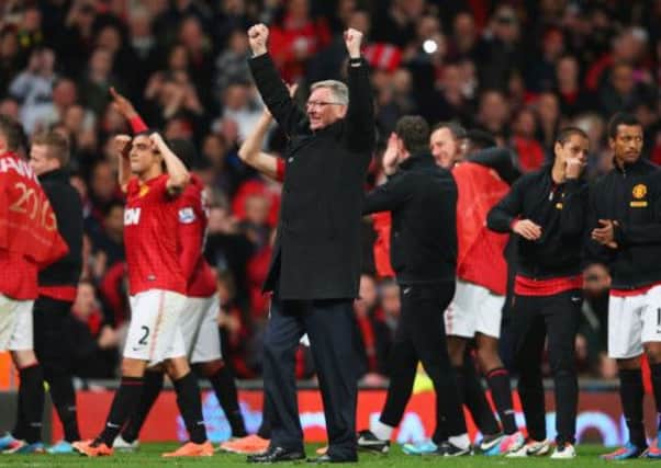 Sir Alex Ferguson celebrates his 13th title win with his players after Monday night's game against Aston Villa.  Picture: Getty