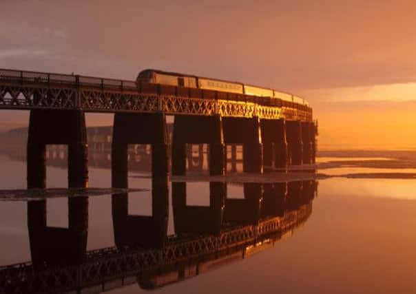 The UK transport minister has called for the East Coast line to be sold off. Pictured - an East Coast train crosses the Tay Bridge. Picture: submitted