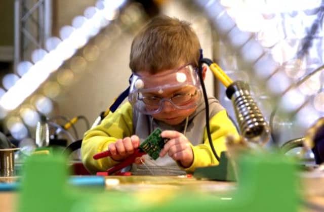 A youngster gets to grips with circuitry at the Edinburgh Science Festival. Picture: Esme Allen