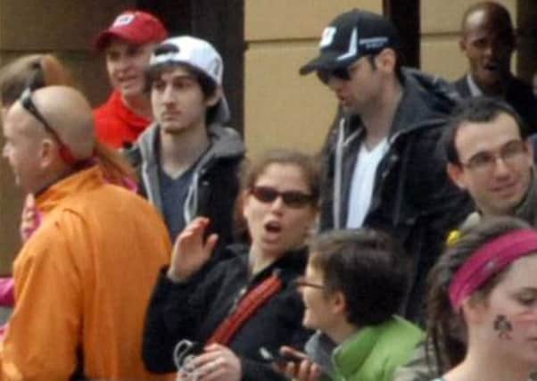 The bomb suspect brothers, at back, were watching in the crowd. Picture: AP