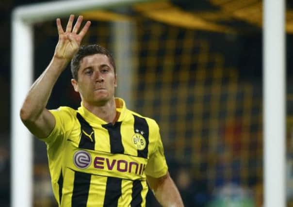 Borussia Dortmund striker Robert Lewandowski celebrates his fourth goal           Picture: Reuters