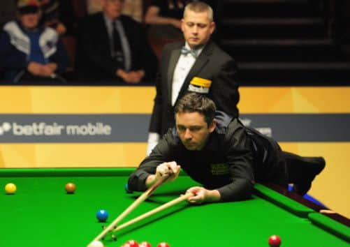 Despite his minifightback, Alan McManus was unable to reel in Ding Junhui yesterday. Picture: Getty