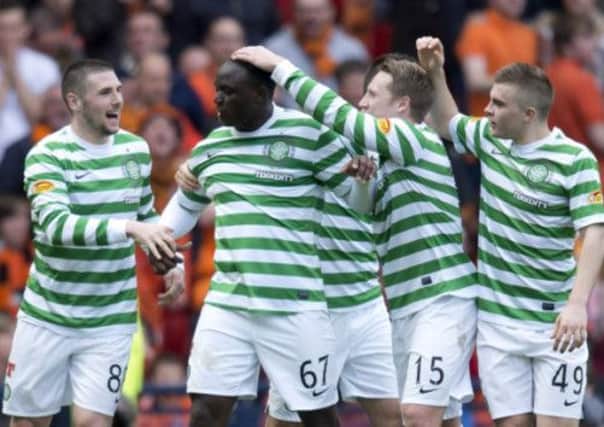Celtic are celebrating that Victor Wanyama (centre) is staying at the club. Picture: SNS
