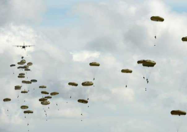 Members of the Parachute Regiment exit from an aeroplane during a British And French Airborne Forces joint exercise. Picture: Getty