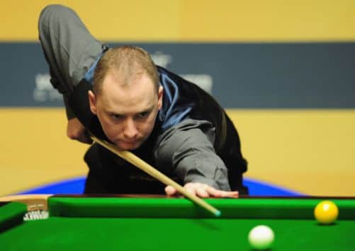 Graeme Dott resumes today 62 down to Shaun Murphy in the second round. Picture: Jamie McDonald/Getty