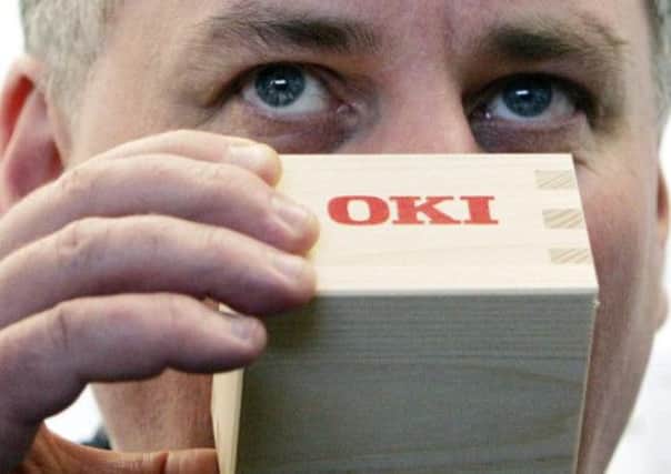Lord McConnell on a visit to OKI's Cumbernauld site in 2005. The firm will axe 175 jobs. Picture: PA