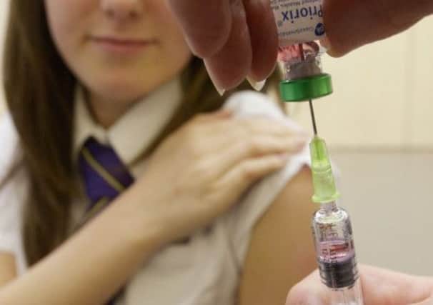 Lucy Butler, 15, prepares for her measles jab at her school in Teesside, as the alert over a measles epidemic in England and Wales spreads. Picture: PA