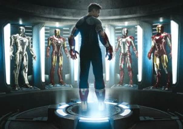 Troubled do-gooder Robert Downey Jr surrounded by his troupe of Iron Man alter egos