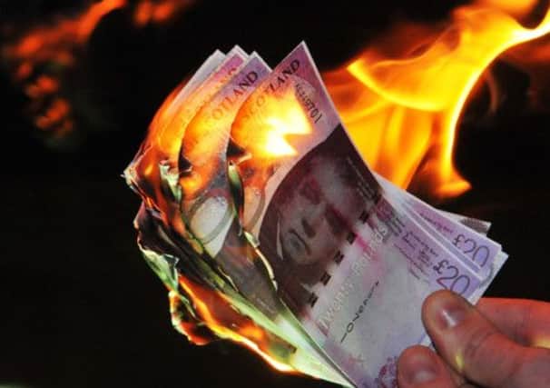 Up in smoke  help is there to stop consumers burning money by paying too much for their energy  Picture: Jon Savage
