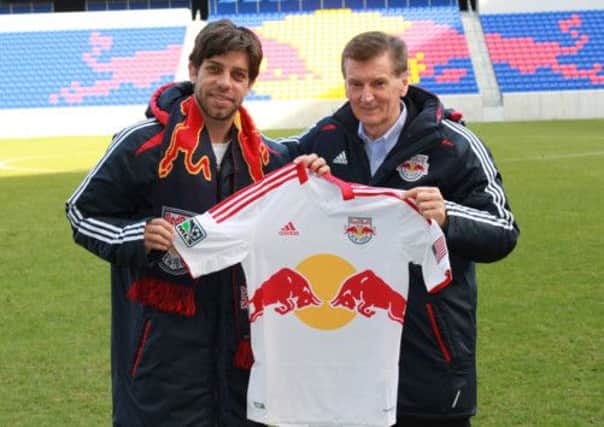 Andy Roxburgh is welcomed to New York Red Bulls by Juninho. Picture: Contributed
