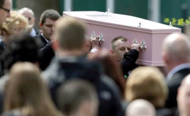 The teenager's pink coffin was taken for burial after the service by horse-drawn hearse. Picture: PA