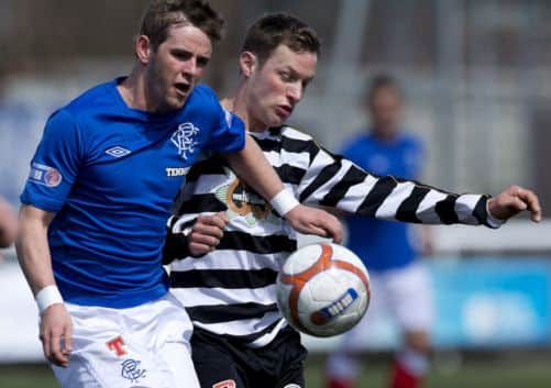 Goalscorer David Templeton goes shoulder to shoulder with East Stirling's David Greenhill. Picture: SNS