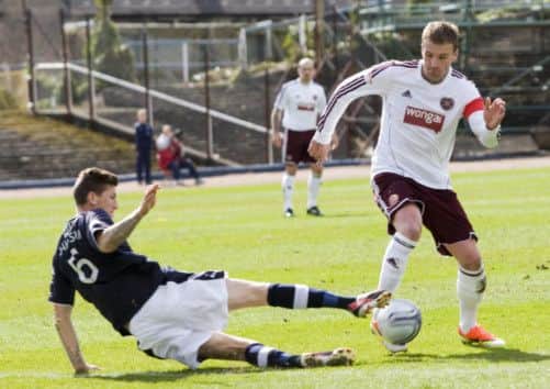 Iain Davidson challenges Ryan Stevenson. Picture: SNS