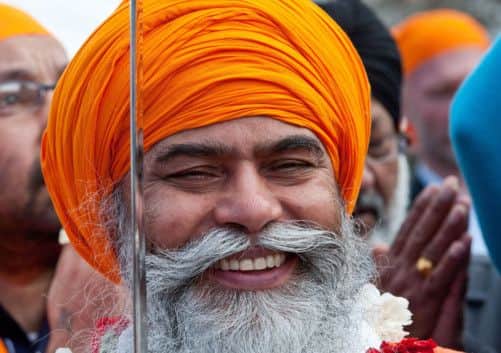 A Sikh worshipper celebrates the opening. Picture: Wattie Cheung
