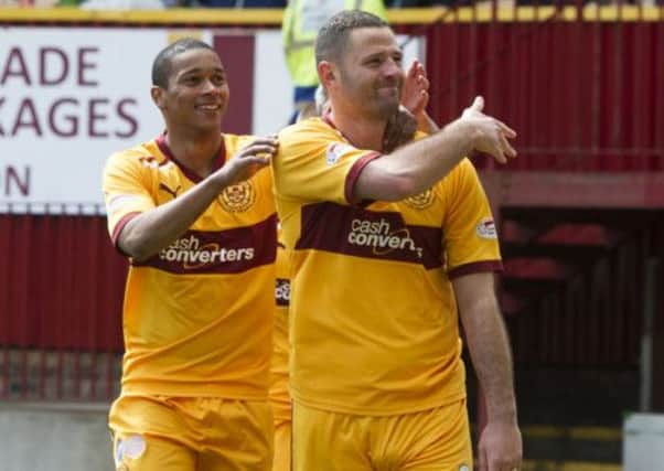 Michael Higdon 'brushes off' criticism as he celebrates his goal. Picture: SNS