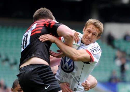 Jonny Wilkinson takes on his opposite number Owen Farrell. Picture: Getty