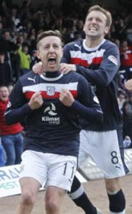 Ryan Conroy celebrates his goal with Dundee team-mate Kevin McBride in the 1-0 win over Hearts. Picture: PA