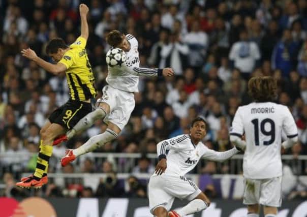 Sergio Ramos and Robert Lewandowski battle during last nights Champions League semifinal. Picture: Reuters