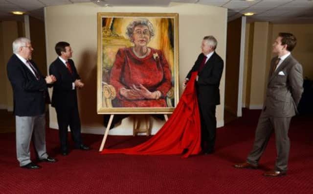 The 'expressionist-style' painting was undertaken by Dan Llywelyn Hall, said to be the youngest artist to paint the Queens portrait. Picture: PA