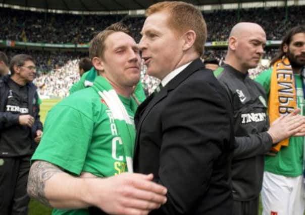 Neil Lennon celebrates winning the SPL title with Kris Commons, who was rested for Celtic's defeat at the hands of Motherwell. Picture: SNS