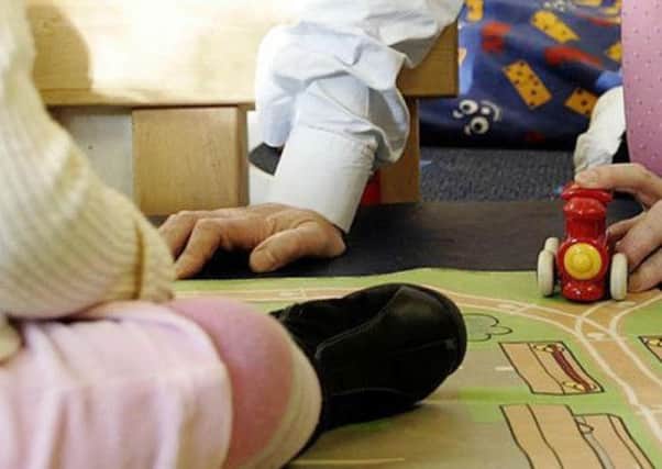 A childrens' charity has urged the SNP to extend free childcare to Scotland's poorest families. Picture: PA