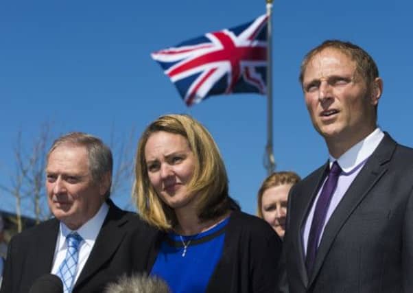 SAS sniper Sergeant Danny Nightingale outside the court martial centre, with his wife and father. Picture: PA