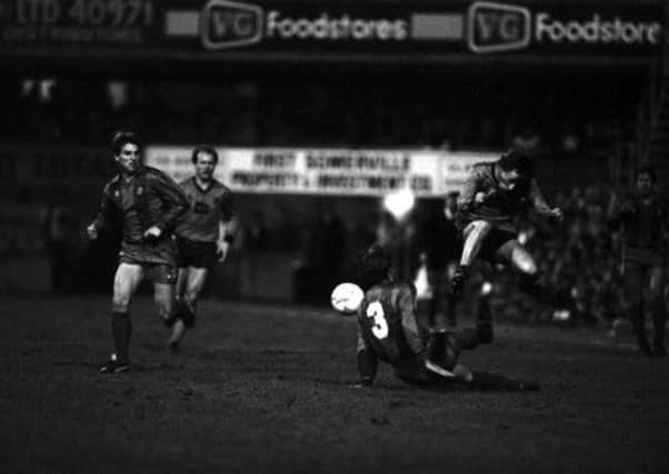 Paul Sturrock jumps a tackle by Barcelona defender Migueli during the tie at Tannadice. Picture: TSPL