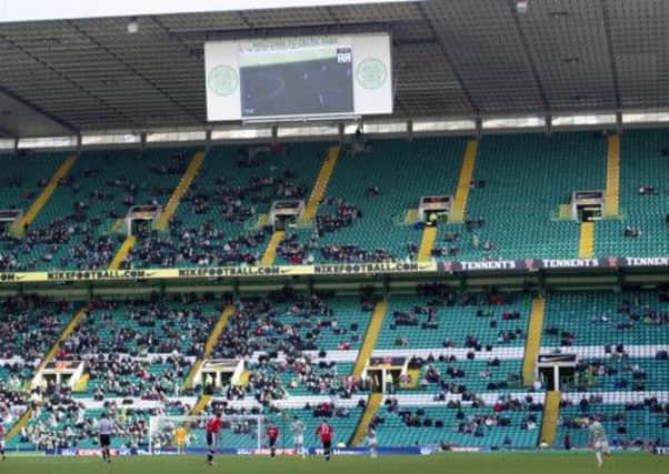 There were plenty of empty seats inside Celtic Park when Dundee visited in February. 
Picture: SNS
