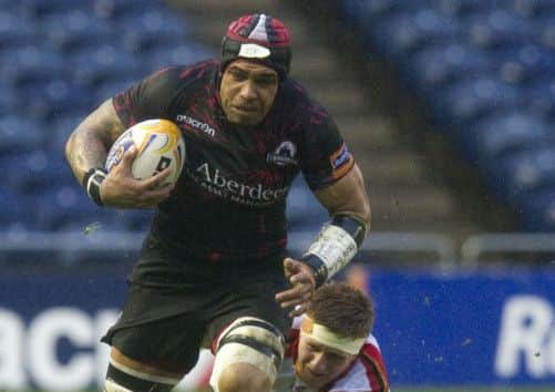 Netani Talei resists a challenge by Newport Dragons' Andrew Coombs during Edinburgh's 31-24 victory last night. Picture :SNS