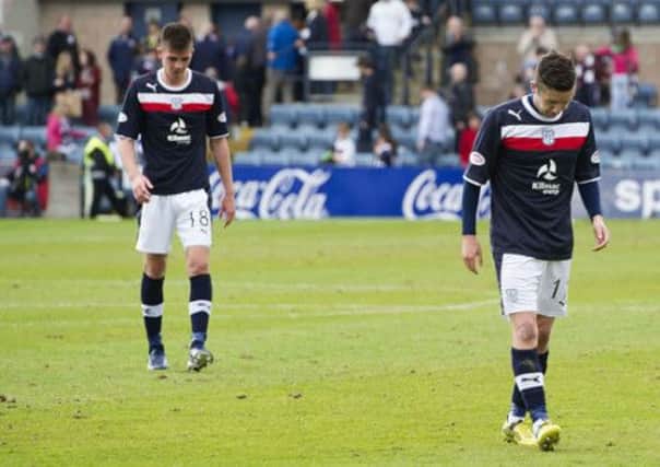 Dundee trudge off after being relegated from the SPL today. Picture: SNS