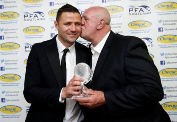 Michael Higdon (left) celebrates with his proud dad Norman. Picture: SNS