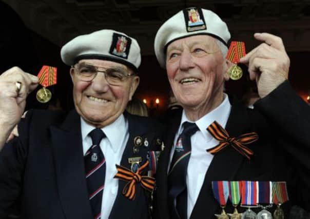 Jock Dempster, right, and Bill Bannerman show off their Russian medals in 2010. Picture: Ian Rutherford