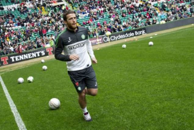 Celtic full-back Adam Matthews warms up before yesterdays Family Fun Day. Picture: SNS