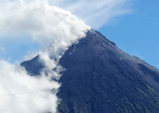 Volcano Mount Mayon spews a thick column of ash. Picture: Getty