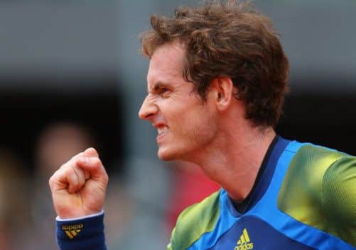 Andy Murray celebrates after winning the second-set tie-break to clinch victory over Florian Mayer in the Madrid Open.  Picture: Getty