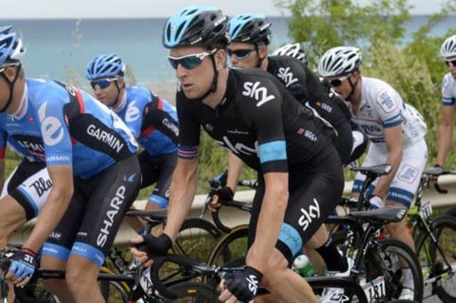 Sir Bradley Wiggins rides safely in the bunch yesterday before the drama at the end of stage four of the Giro dItalia. Picture: AP