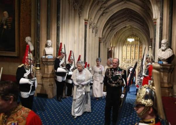 Queen Elizabeth II and the Duke of Edinburgh arrive at Parliament. Picture: PA