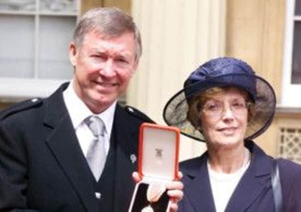 Sir Alex Ferguson and wife Cathy after he was knighted. Picture: PA