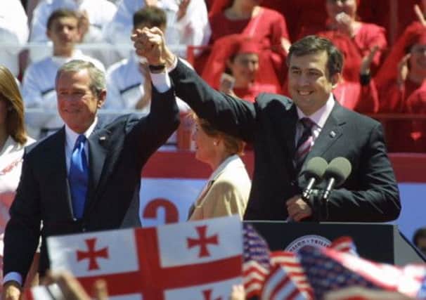George W Bush with Georgian president Mikhail Saakashvili on this day in 2005 when a grenade was thrown at him in Tblisi. Picture: Getty