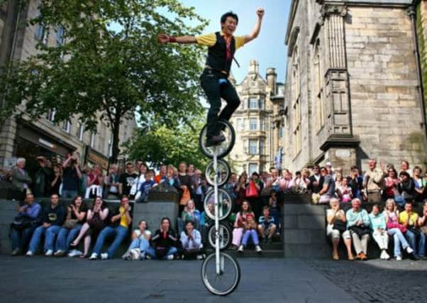 Street entertainers perform during the Edinburgh Fringe. Picture: Getty