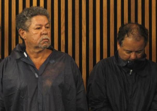 Pedro Castro and Ariel Castro stand in the courtroom during Ariel's arraignment. Picture: Getty